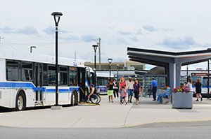 City buses and riders at the North Bay Transit Terminal on Oak St W